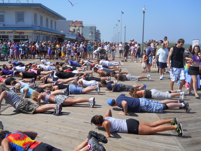 Spectators and tourists watch as CrossFit Lewes stages their first flash mob workout routine. BY MOLLY MACMILLAN