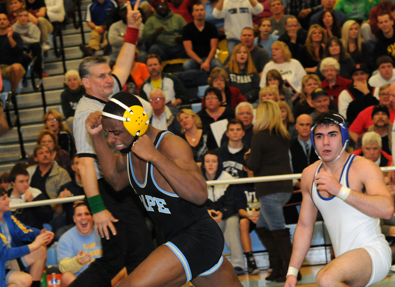 Cape 182-pounder Andre Flowers gets a takedown to defeat St. Georges' Nick Dooley. BY DAN COOK