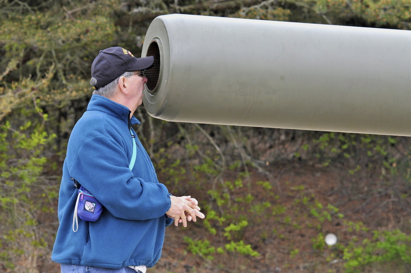 Dick Rothenhoefer, a Vietnam veteran from Millville, gets up close and personal with one of the guns at Fort Miles. BY RON MACARTHUR