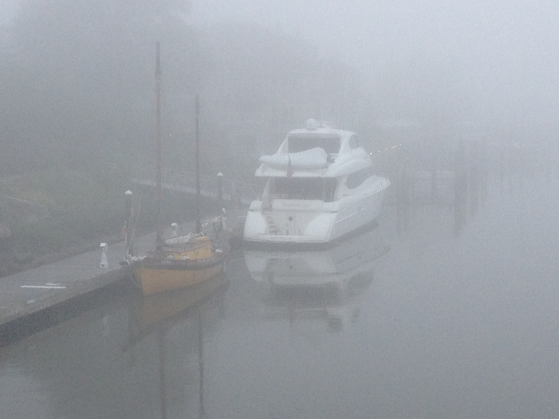 Wednesday morning's fog shrouds boats at the city dock in Lewes. BY DENNIS FORNEY