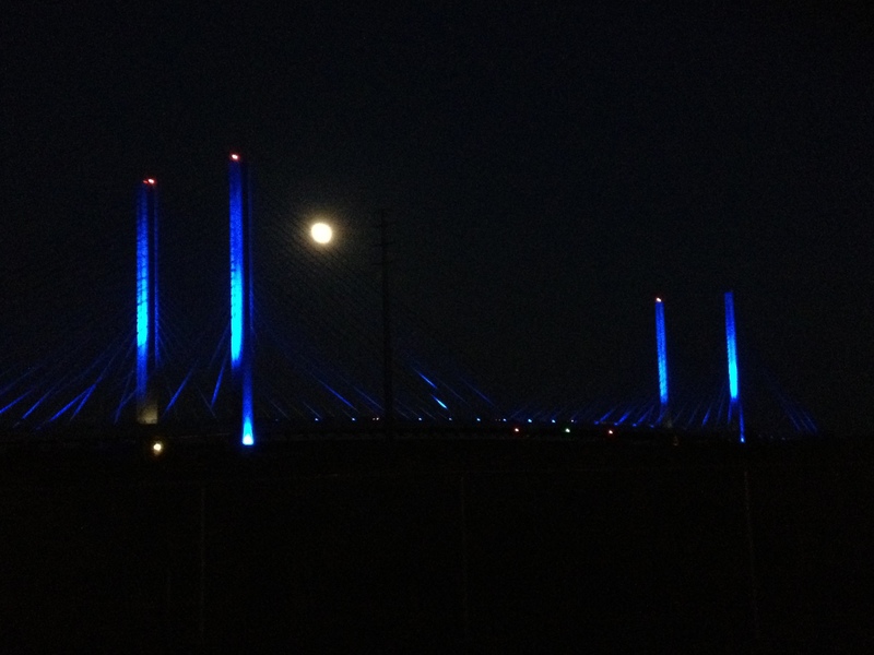 Full moon (minus one day) rising through the harp strings of the new Indian River Inlet Bridge. BY DENNIS FORNEY