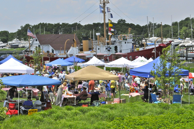 Tents and people fill Canalfront Park during the first Picnic in the Park hosted by Friends of Canalfront Park. BY RON MACARTHUR