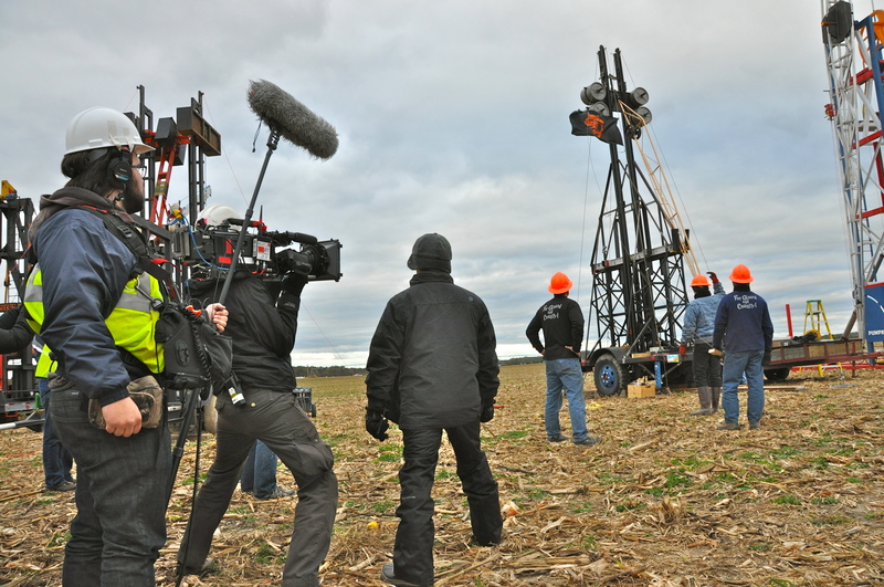 A crew films as a team prepares to fire its first shot of the competition. BY RON MACARTHUR
