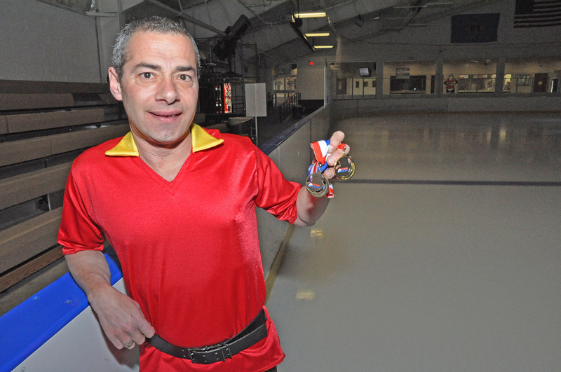Thomas Harrison of Millsboro shows off the two medals he won at the U.S. Adult Figure Skating Championships in Scottsdale, Ariz. BY NICK ROTH