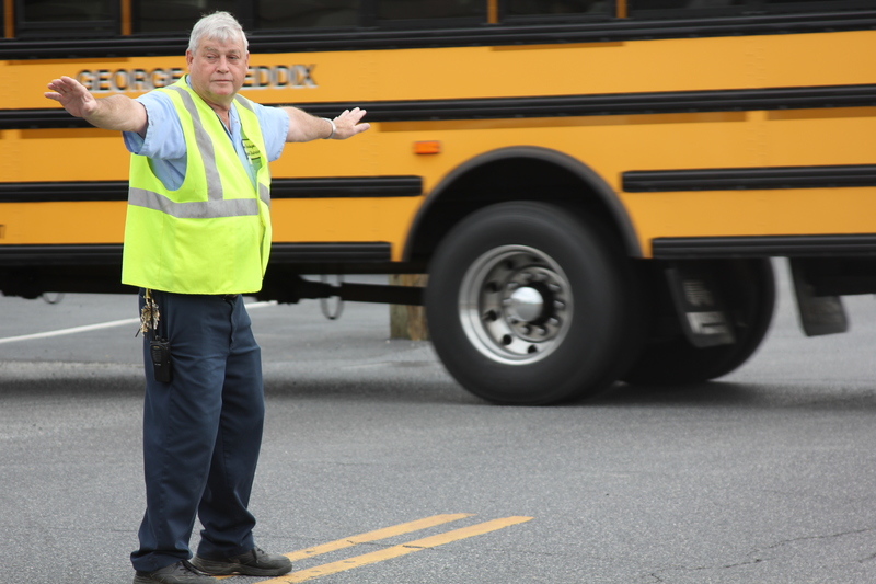 George Brown stops traffic on Federal Street every day during Milton Elementary School's dismissal. BY MELISSA STEELE