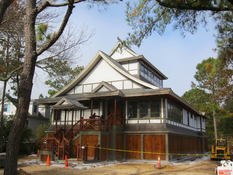 Contractor Philip Bradley is finishing up this Japanese-style house in North Shores. The breakaway walls at the ground level are stained bamboo. The house and property, according to a streetside sign, go by the name Kitsu.