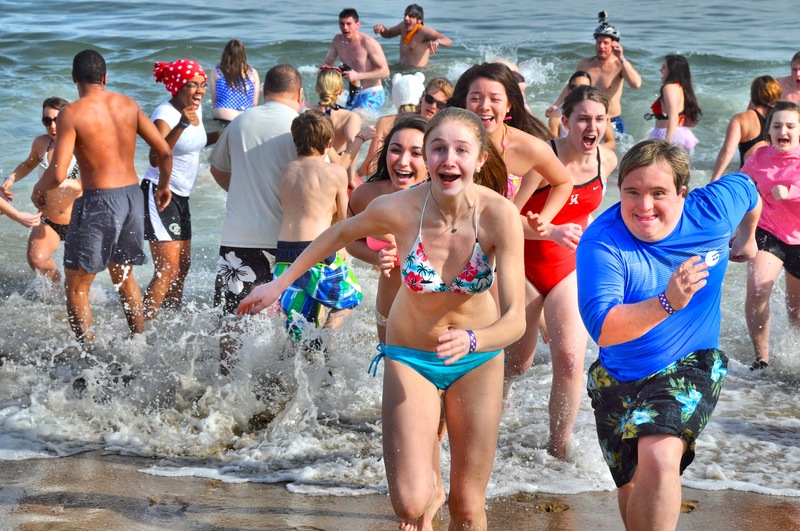 Runners sprint into the water for the Polar Bear Plunge, but they run even faster on the way out. The jolt of nearly freezing ocean water can be seen on plungers' faces as they sprint toward the sand. BY RON MACARTHUR