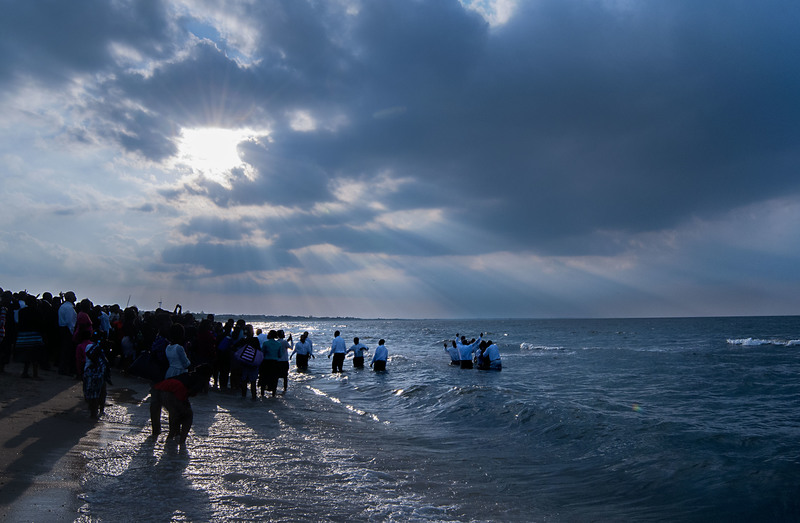 Hundreds gather on Lewes Beach for blessings, prayer and water baptism. BY DENY HOWETH