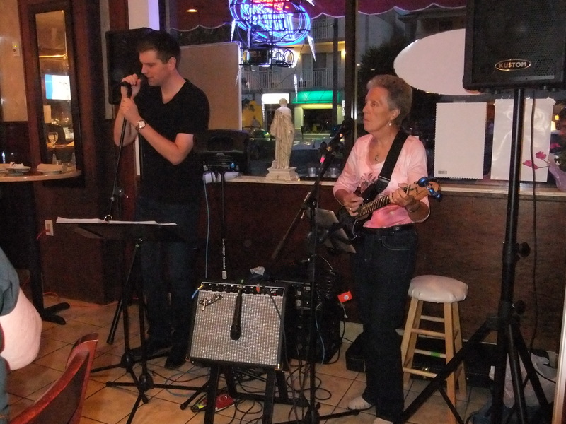 Mark Luckenbill, left, and Glenda Diem rock out for an audience at Ambrosia Restaurant and Wine Bar in Rehoboth Beach. There is a 40-year age difference between the two performers, who were introduced by a mutual friend. BY TAGGART HOUCK