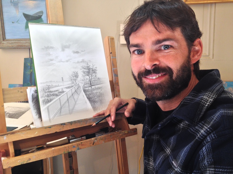 Abraxas takes a break from his work on a pencil sketch for the 2015 Lewes Chamber of Commerce Visitors' Guide. BY DENNIS FORNEY