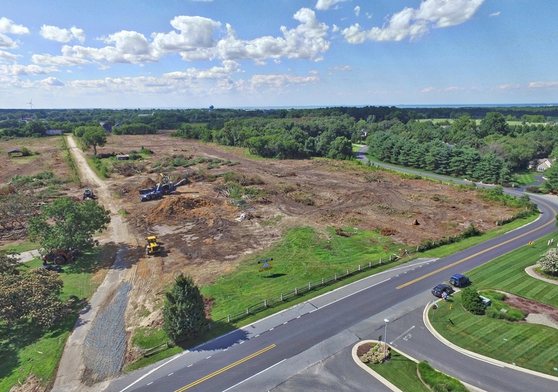 A section of trees along Gills Neck Road has been removed during site work for the new Showfield subdivision. Access to the community will be across from the entrance to Wolfe Pointe, shown at the bottom of the photograph. BY NICK ROTH/AERIAL PHOTOGRAPHIC DEVICE (APD)