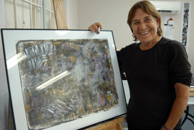 Abstract artist Barbara Warden poses with one of the pieces to be included in an upcoming art show in April 2016 at the Biggs Museum of American Art in Dover. BY MADDY LAURIA
