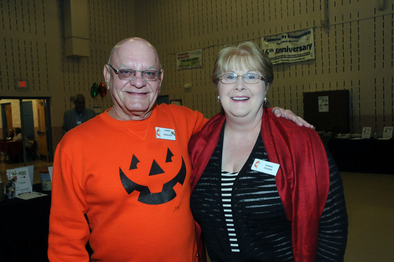 Christmas Joy! 365 Co-chairs Larry Ziegler and Diana Young take a break between the crowds of bidders. BY STEVEN BILLUPS