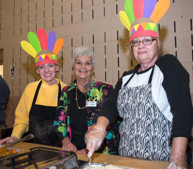Pitching in at the dinner are (l-r) Suzanne Landon, Diane Leitch and Ruthann Barnes. BY DENY HOWETH