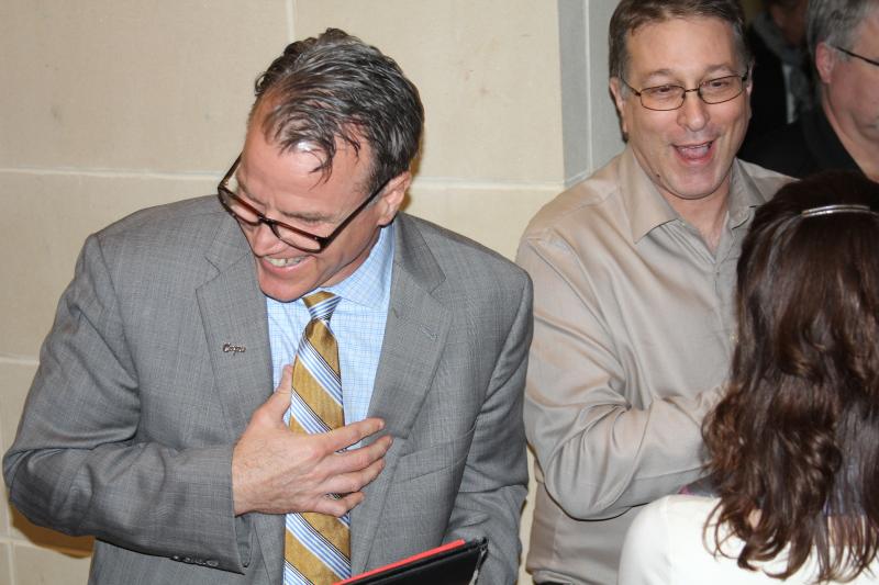 Superintendent Robert Fulton, left, is all smiles after Cape Henlopen voters approved a $48 million referendum. Also celebrating is board member Jason Bradley. BY MELISSA STEELE