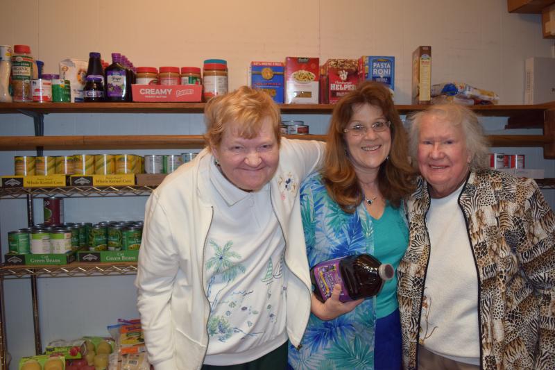 Milton Food Pantry volunteers and Georgetown residents (l-r) Evelyn Brunke, Helen Bivens and Betty Brunke make weekly volunteering a family event. BY MADDY LAURIA