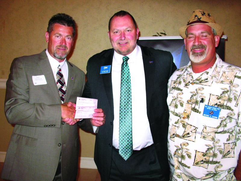Bud Whitlock and Michael Morris, members of the Knights of Columbus Brother Vincent Council from Smyrna, present a donation to KSI totaling over $3,000. Shown are (l-r) Bud Whitlock, KSI CEO B. Craig Crouch and Michael Morris. SUBMITTED PHOTO