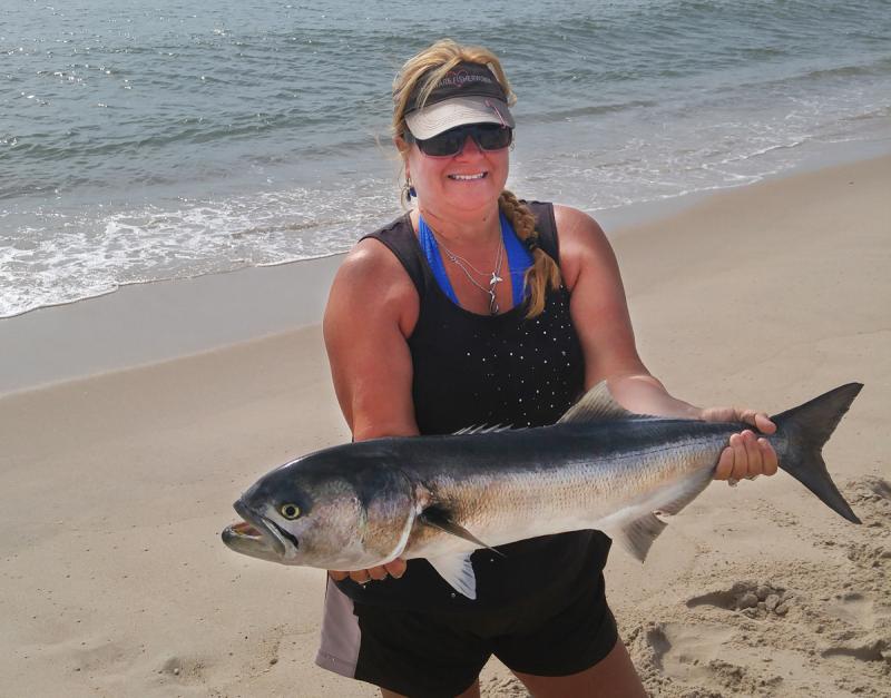 Suzanne Martin shows off the biggest bluefish of the Cast for a Cure Surf Tournament. This fish helped Lewes Harbour Marina Team 1 take first place and rewarded Suzanne with $220. SUBMITTED PHOTO