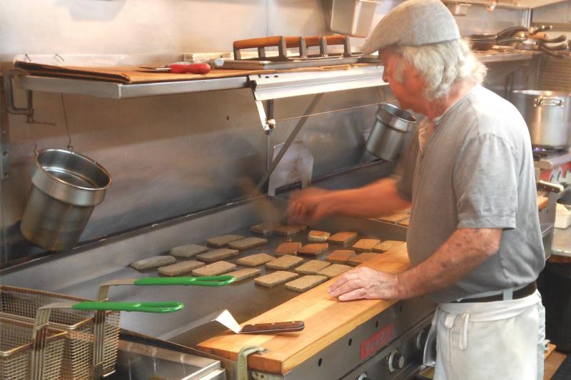 It’s all in the wrist. Like a zen master catching flies with chopsticks, Sunrise Restaurant owner Ismet Bulut uses just his wrist to flip scrapple. CHRIS FLOOD PHOTO