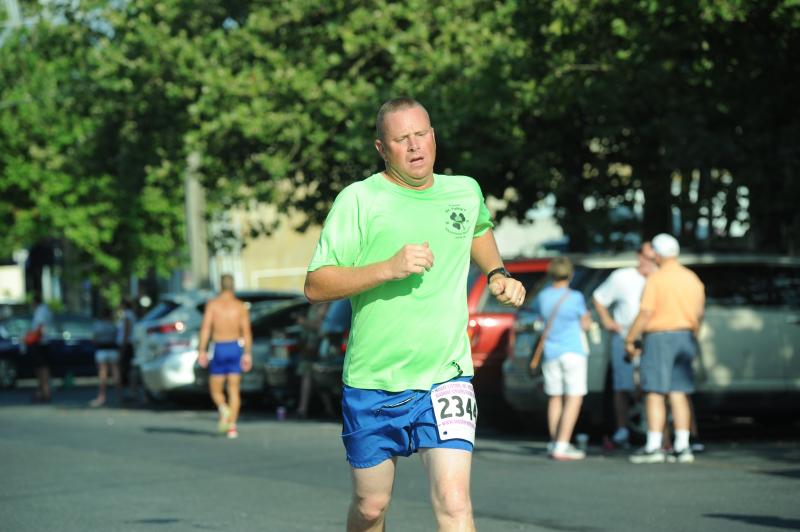 Breck Vanderwende, 43, finishing the Race for the Ribbon 5K is 100 percent Woodbridge, a farmer and former cross country star. Breck was the scorekeeper for Woodbridge in the 41-0 loss to Milton. “There was nothing Milton could have done or anyone could have done,” Breck said. DAVE FREDERICK PHOTO