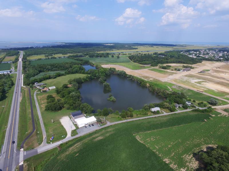 White’s Pond is part of the new Showfield community under construction southeast of Lewes. In this photograph, Freeman Highway is on the left and Monroe Avenue is below the pond. NICK ROTH PHOTO