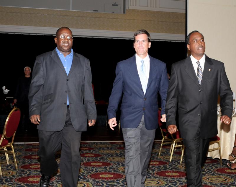 Tim Bamforth flanked by Delaware State cross country teammates Ray Mitchell (West Philly) and Wes Ridgeway (William Penn) is introduced at Hall of Fame banquet. DAVE FREDERICK PHOTO