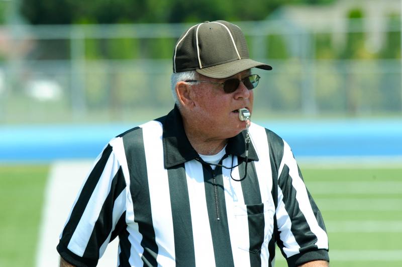 Referee Judge John O’Bier is entering his 43rd year of officiating. The man doesn’t play around; his calls always stand. DAVE FREDERICK PHOTO
