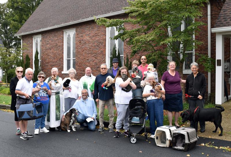 Pets pose with their humans after being blessed. SUBMITTED PHOTO
