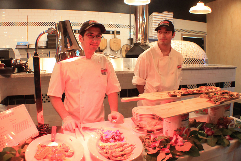 Touch of Italy Pizza Operations General Manager Biagio Lucci, left, and 2017 Las Vegas Neapolitan Pizza Championship third-place winner Kyle Gardner provided unlimited pies to peckish partiers at Carnevale 2016. JOHN DONATO PHOTO