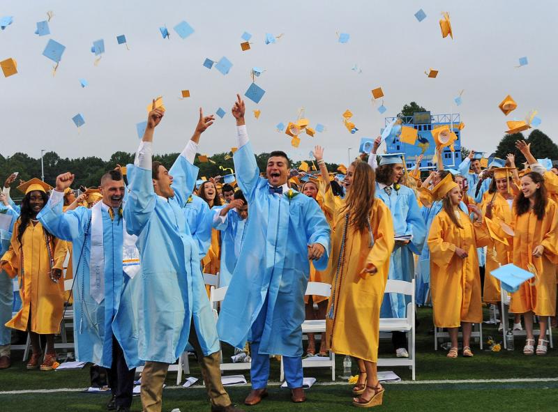 Class of 2017 officers lead the grads in tossing their mortarboards after Board of Education President Andy Lewis declared them graduated. Shown are (l-r) Class of 2017 President Erik-Stephane Stancofski, Vice President Cory Lawson, Secretary Brock Maloomian and Treasurer Hannah Derrickson. DAN COOK PHOTO
