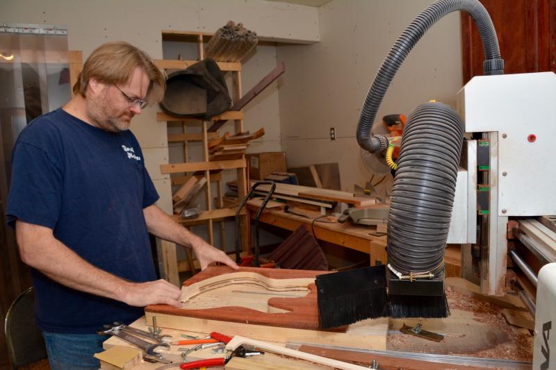 Tom Baker’s workshop is filled with computerized, high-tech equipment that has cut his production time from several weeks to a few days. RON MACARTHUR PHOTO