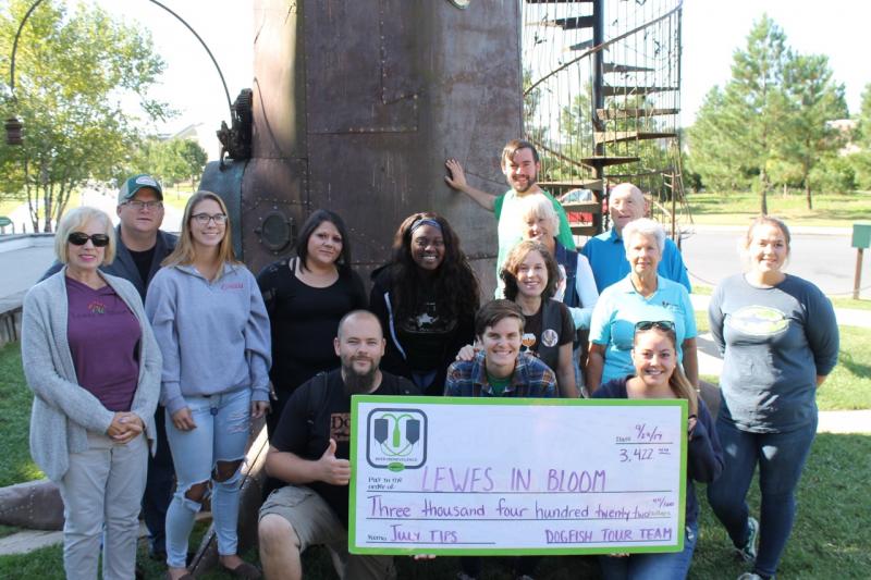 Shown are (l-r) Nancy Phillips, co-chair, Lewes In Bloom; Matt Fetherston, tour and tasting manager; Kelsea Taylor; Nikki Maleska; Wally Hines, assistant tour and tasting manager; Keanna Morgan; Tara Bowden; Stephanie Staib; Judith Hanson, co-chair, Lewes In Bloom; Kurt Secrest; Warren Golde, founder, Lewes In Bloom; Marilyn Vai, board member, Lewes In Bloom; Kim Koot; and Leah Toomey. SUBMITTED PHOTO