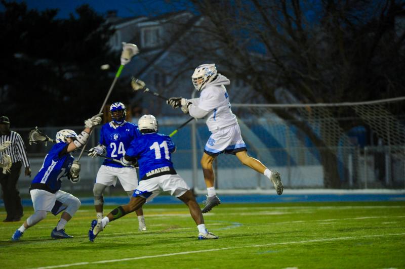 Gabe Best takes the high road against Dover defense. DAVE FREDERICK PHOTO