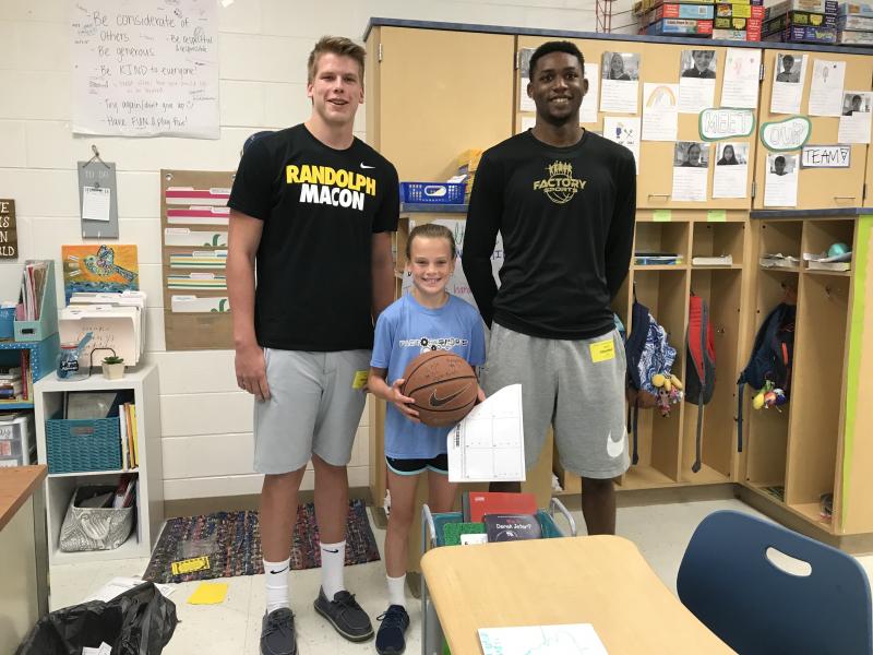 Ian Robertson, left, and Randy Rickards present Ally Diehl with a signed ball after she raised more than $500 for the Jump Rope for Heart program. SUBMITTED PHOTO