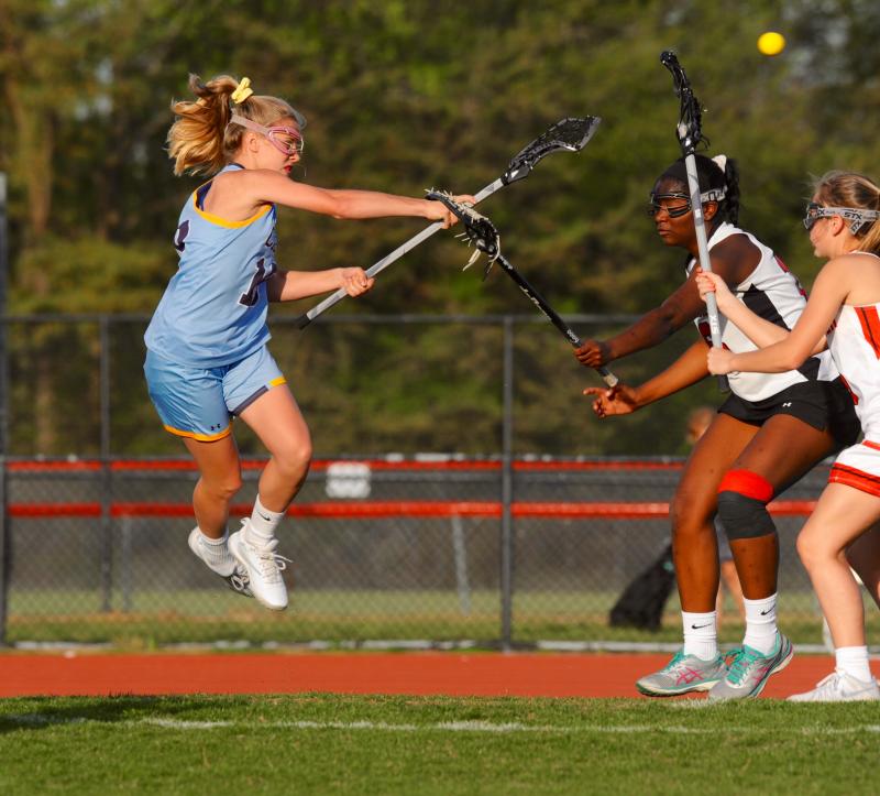Freshman Julie Heffernan is so fly she jumps and buries a shot over the defense. In field hockey she plays goalie – go figure. DAVE FREDERICK PHOTO