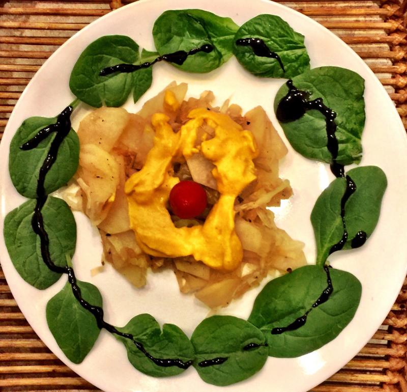 Balsamic Glaze drizzled to enhance main dish of potatoes and cabbage