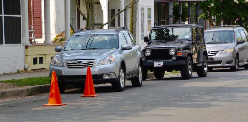 Cones placed on Market Street are used to illegally reserve residential parking spaces. The problem occurs throughout the city, including the beach area. RON MACARTHUR PHOTO