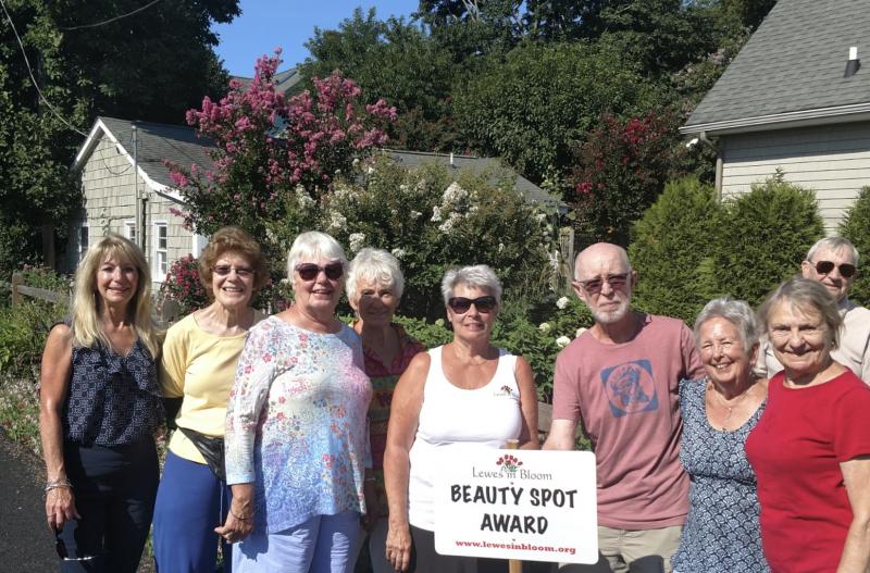Recognizing the Beauty Spot for August are (l-r) Linda MacDonald, Delores Wardwell, Ann-Marie Rooney, Marilyn Nugent, Marilyn Vai, Bill Arvidson, Patsy Arvidson, Peg Woods and Don Woods. Not pictured are homeowners Jan McMahon, Barbara Smith, and Lewes in Bloom Beauty Spot Committee members Lois Sechehay and Betsy Hansot. SUBMITTED PHOTOS