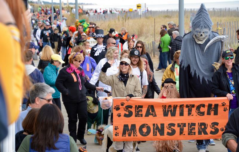 A long line of entrants begin the Sea Witch Festival Costumed Dog Parade on the Rehoboth Beach Boardwalk. RON MACARTHUR PHOTO