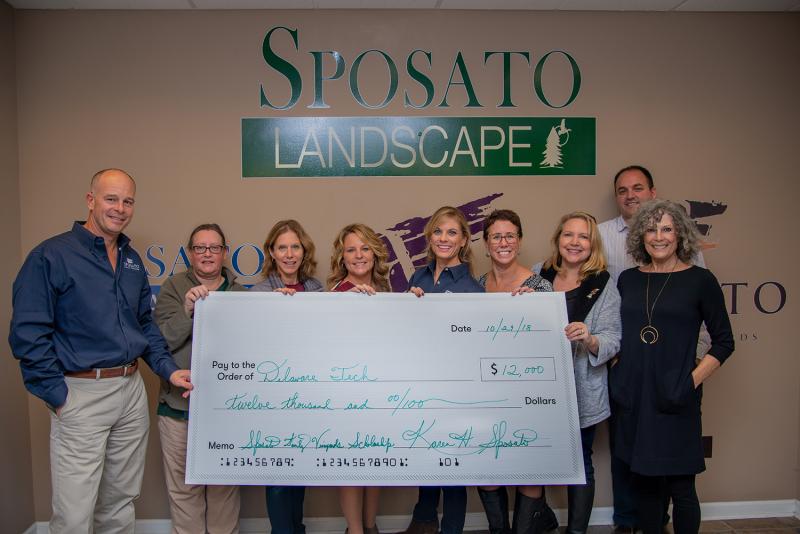Posing with a check for the event proceeds are (l-r) Tony Sposato, Sposato Family Vineyards owner; Laura Brooks, Sposato Companies financial coordinator; Monique Bamforth, Seashore Striders; Janelle Boyer, Delaware Tech director of communication and planning; Karen Howard Sposato, Sposato Family Vineyards owner, president of sales and marketing; Dr. Bobbi Barends, Delaware Tech vice president and Owens Campus director; Karen Falk, Rehoboth Beach Main Street executive director; Jason Bentley, Delaware Tech director of development; and Jo Hawthorne, Taste of Sposato 5K committee member. SUBMITTED PHOTO