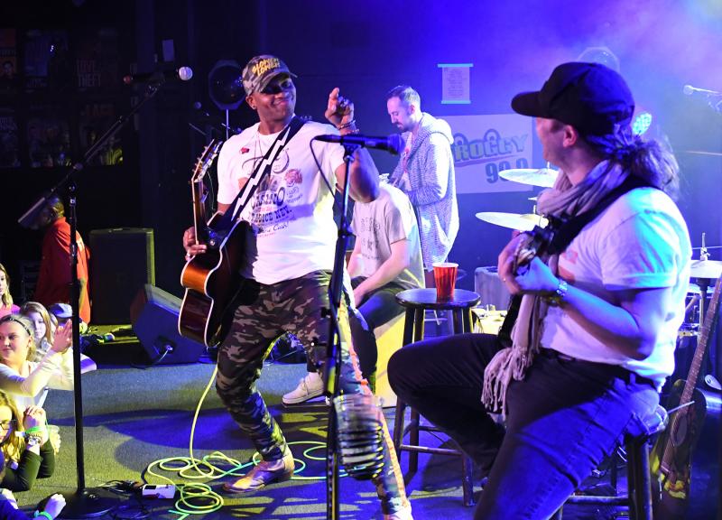 Jimmie Allen jokes with his bass player, Tate Howell, about not liking scrapple.