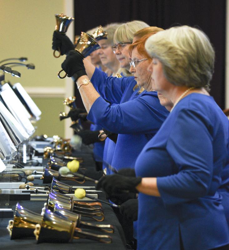 Betsy Gray lifts a handbell. Deny Howeth photos