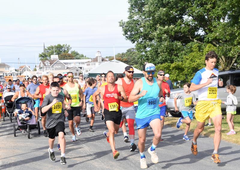 Runners take off at the Fritchman 5K in Lewes in July. DAVE FREDERICK PHOTO