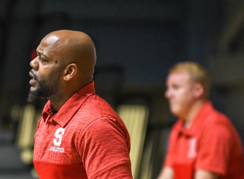 Coach Aaron Harris of Smyrna taught his wrestling team how to handle a dramatic loss on the road with heads held high. DAVE FREDERICK PHOTOS