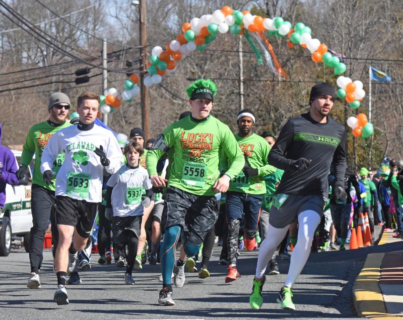 Runners round the first corner after leaving Irish Eyes Milton at the start of the Lucky Leprechaun 5K in 2017. NICK ROTH PHOTO