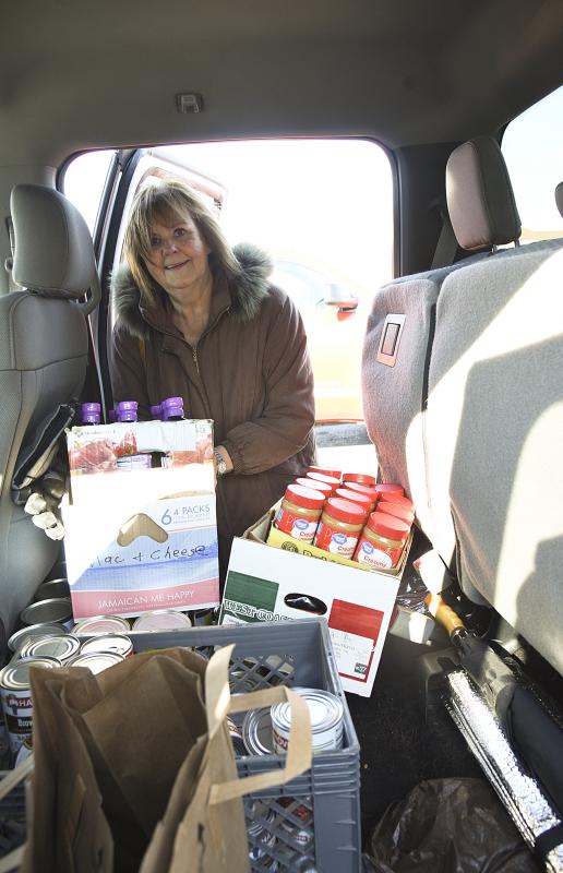 On shopping day Donna Murawski makes several stops for the best prices.