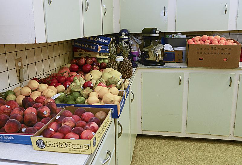 Donated fruit sits ready to be added to bags.