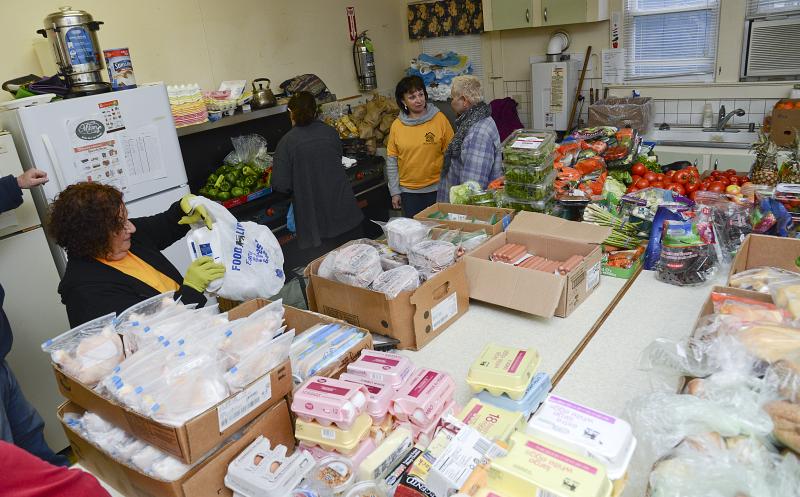 Volunteers have the room organized for quick distribution.