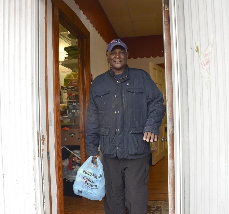 Tony Hazzard leaves the hall with food for his family.