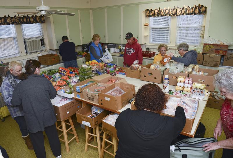 The kitchen is a hive of activity on Monday morning before the pantry opens.